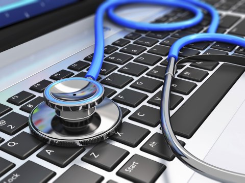 Stethoscope on a computer keyboard
